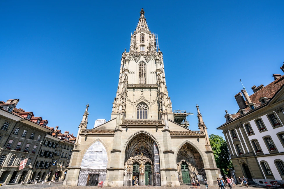 A wide angle view of the Bern Cathedral and its high tower