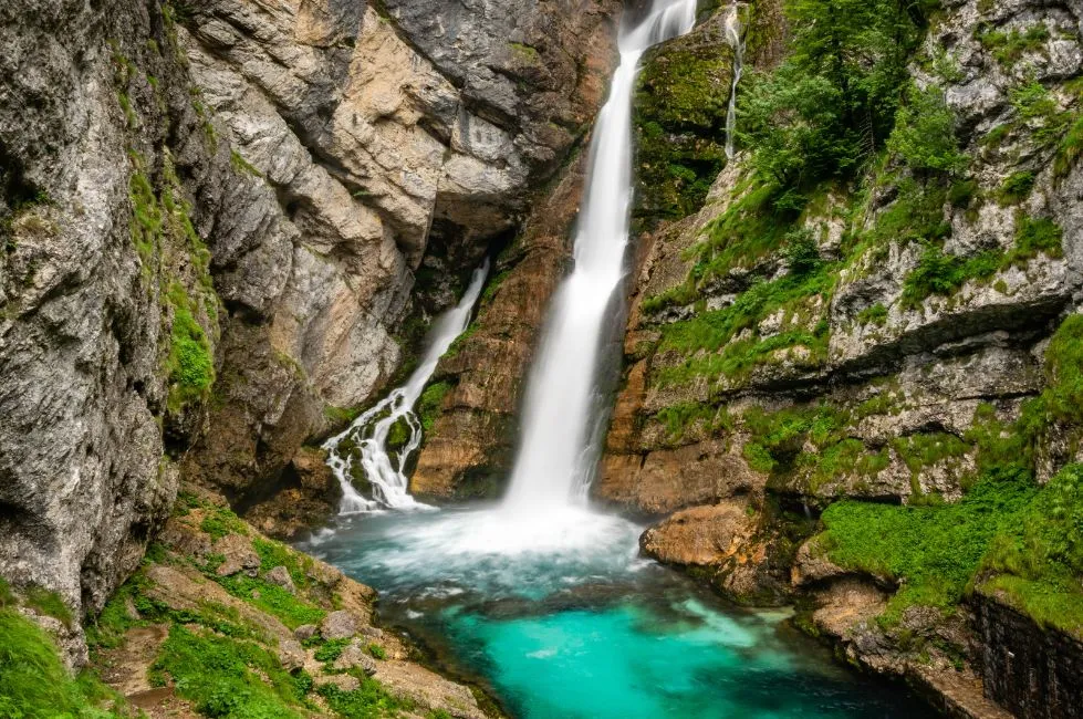 Cascading waters flowing down the Savica Waterfall in Slovenia