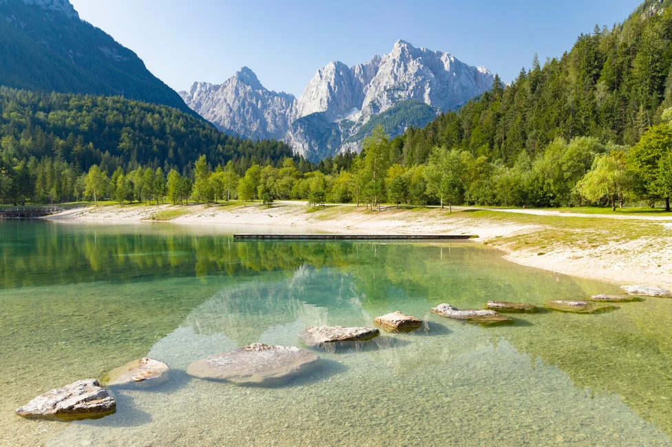 A lake in Triglav National Park with a backdrop of the Julian Alps